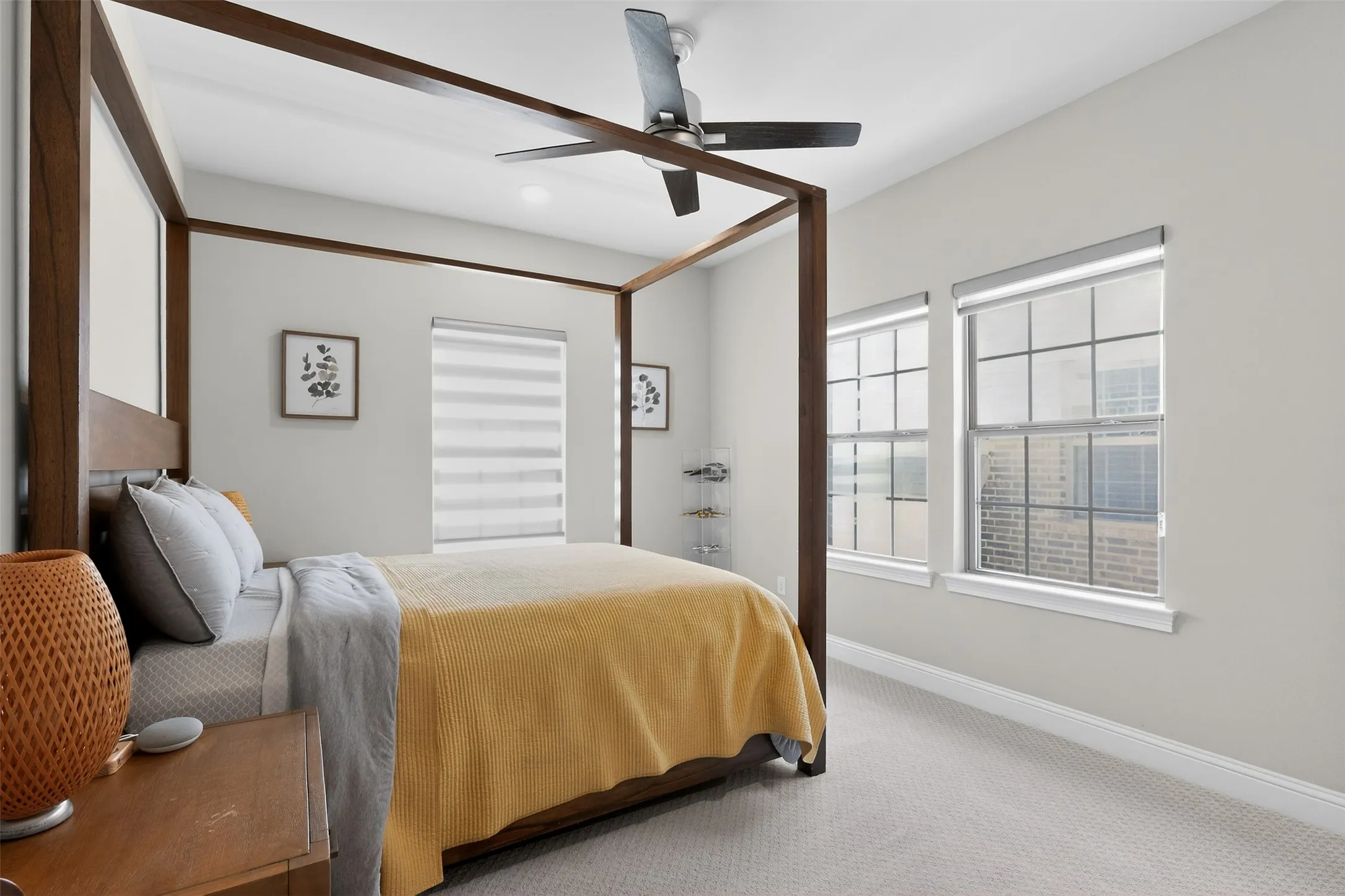 Bedroom with neutral wall tones and light-colored carpeting