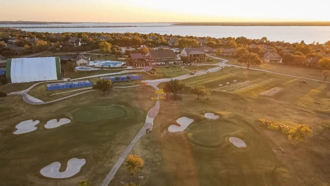 Expansive golf course featuring multiple greens and sand traps