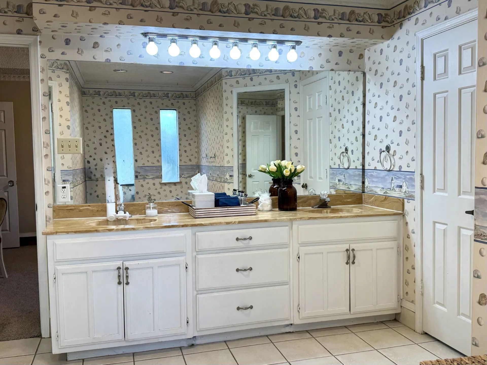 ENSUITE Primary Bath: Dual Sink Vanity, white cabinetry with ample storage...