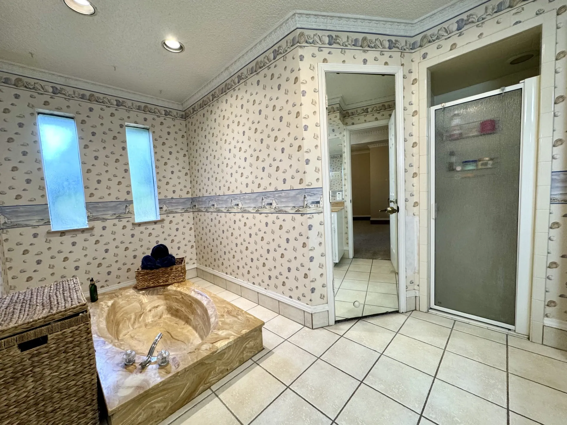 Spa-like Primary Bathroom: Separate Shower, Dual Walk-In Closets, and Sunken Tub...