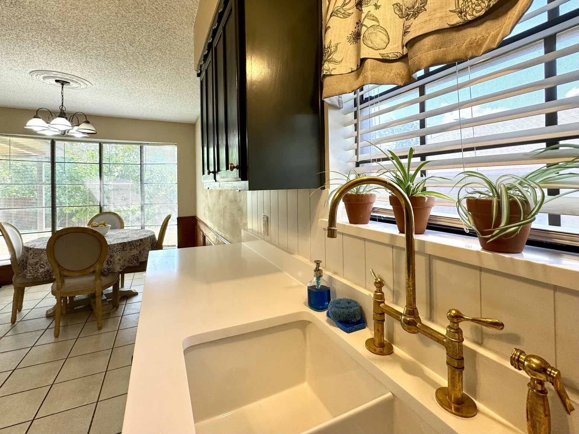 Fabulous BRASS Kitchen Faucet along with White Quartz Countertops... Stunning!!
