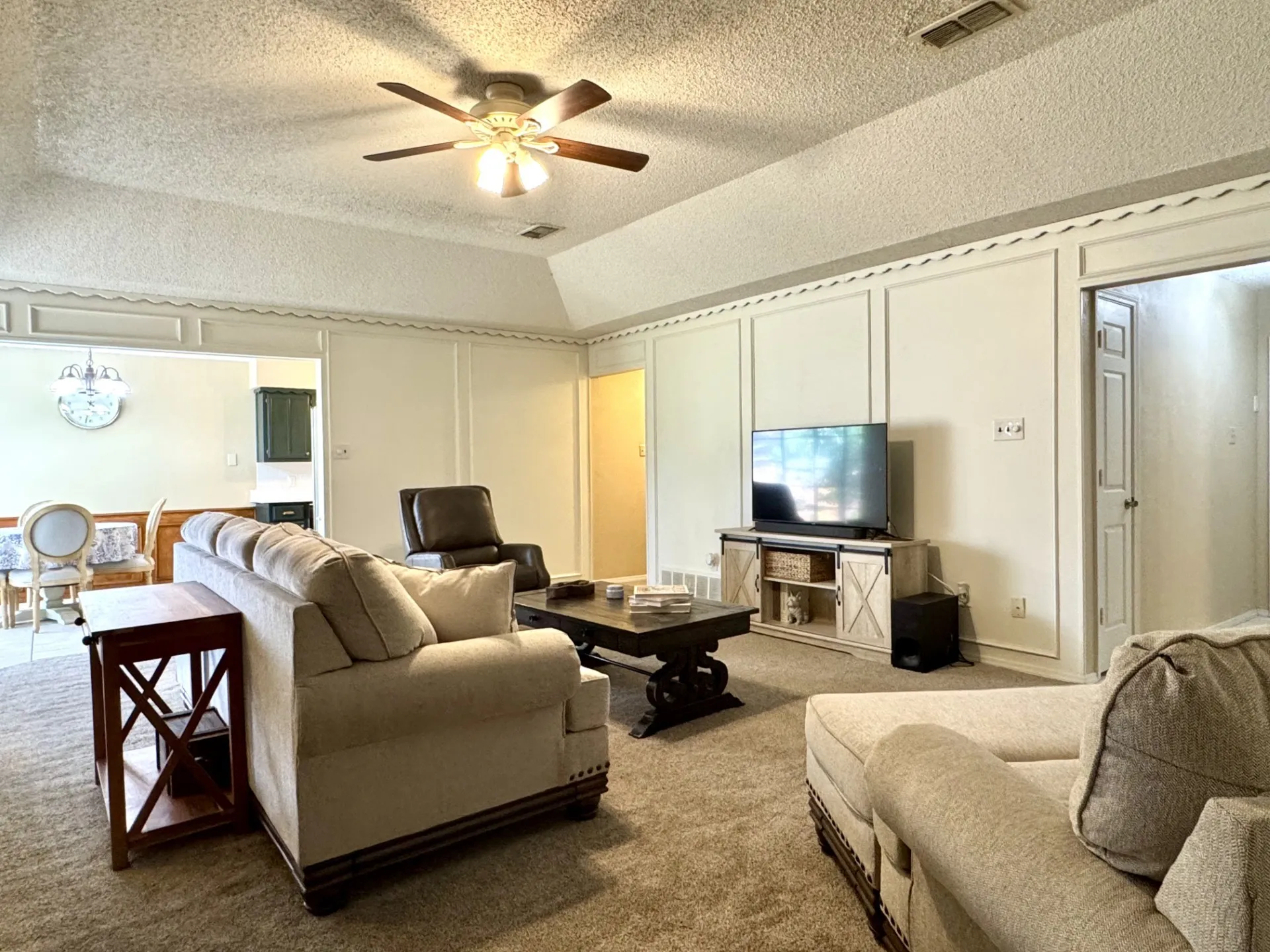 Primary Retreat is located OPPOSITE the Kitchen & Dining Area, across the Living Room...