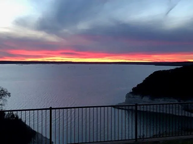 Expansive water body with a vibrant sunset backdrop