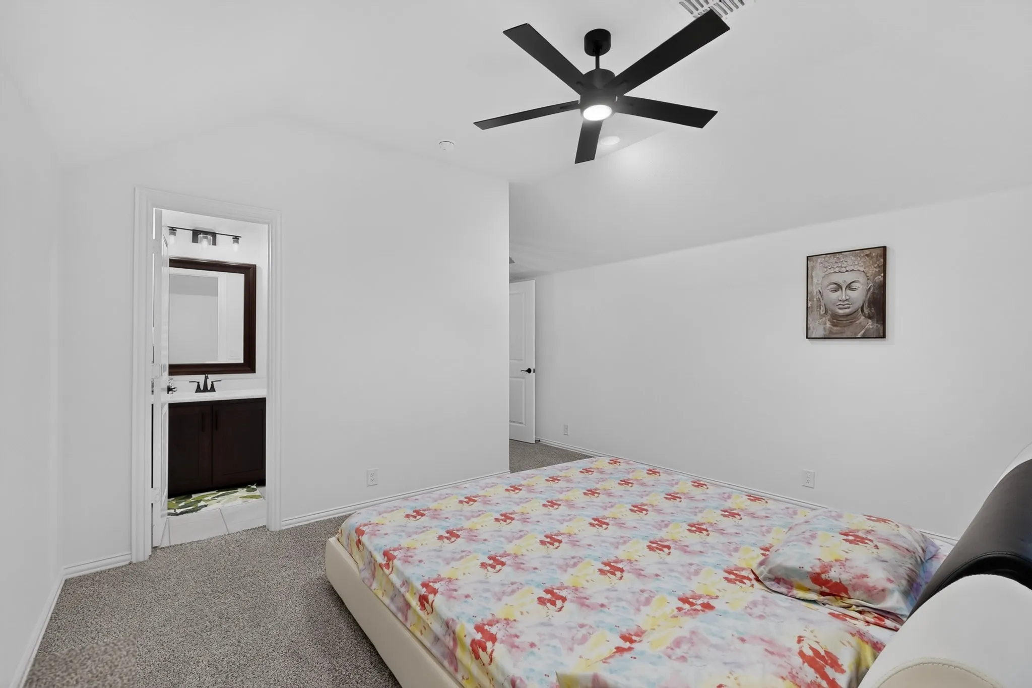 Bedroom featuring vaulted ceilings and carpet flooring