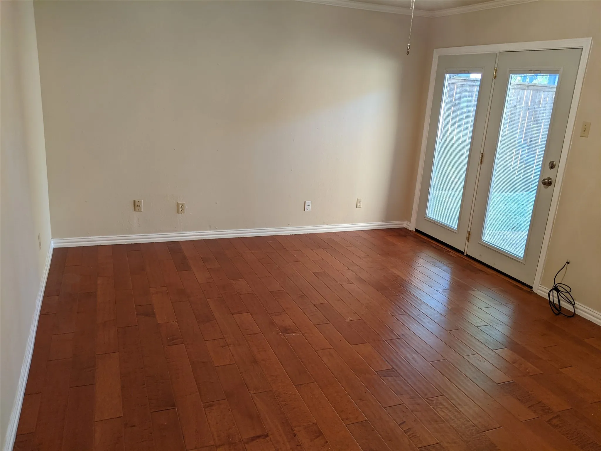 Main bedroom and door to a private yard