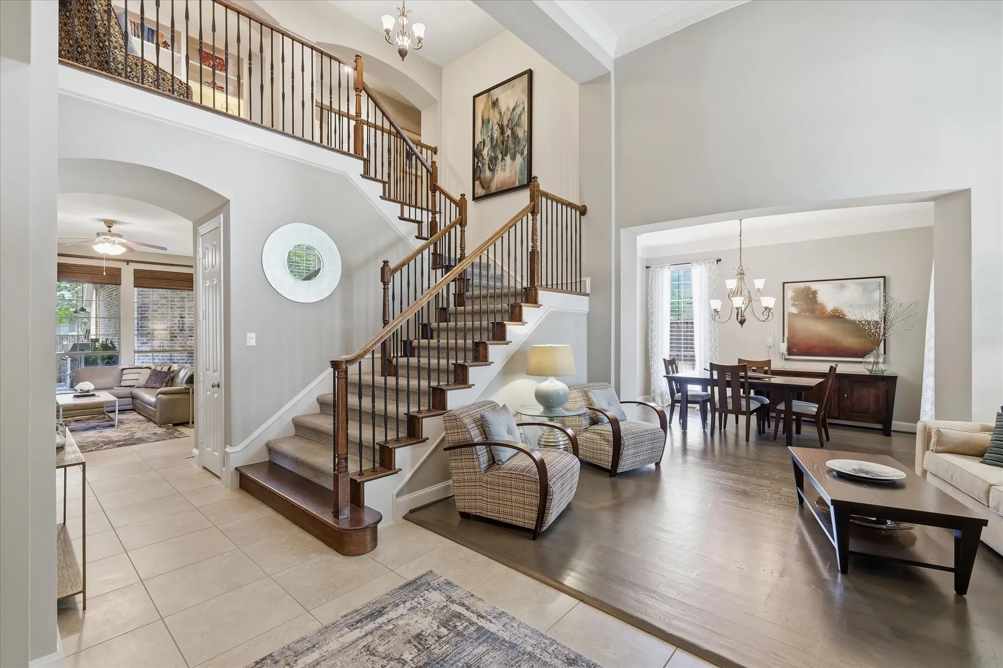 This beautiful staircase with combined living spaces creates an unforgettable first impression for guests