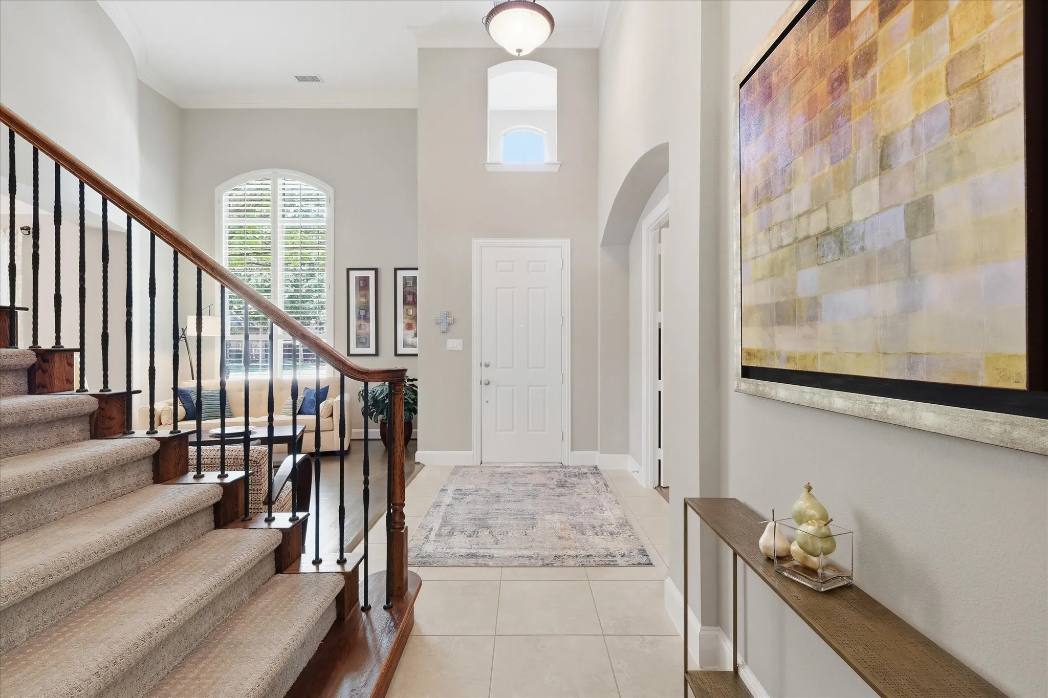 Step inside to enjoy a stunning entry highlighted by soaring ceilings