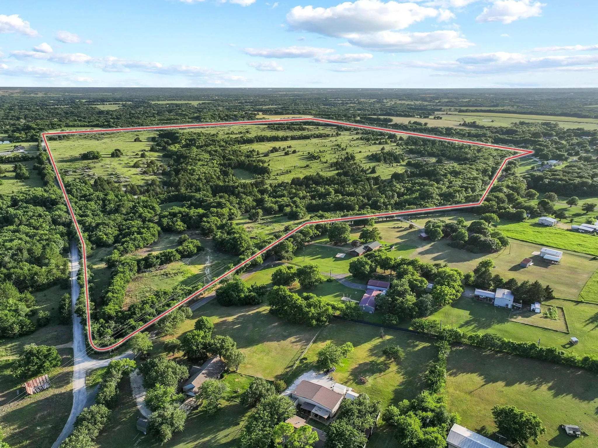 Property borders paved Bethany Road on the north and rocked Adams Road on the east and south