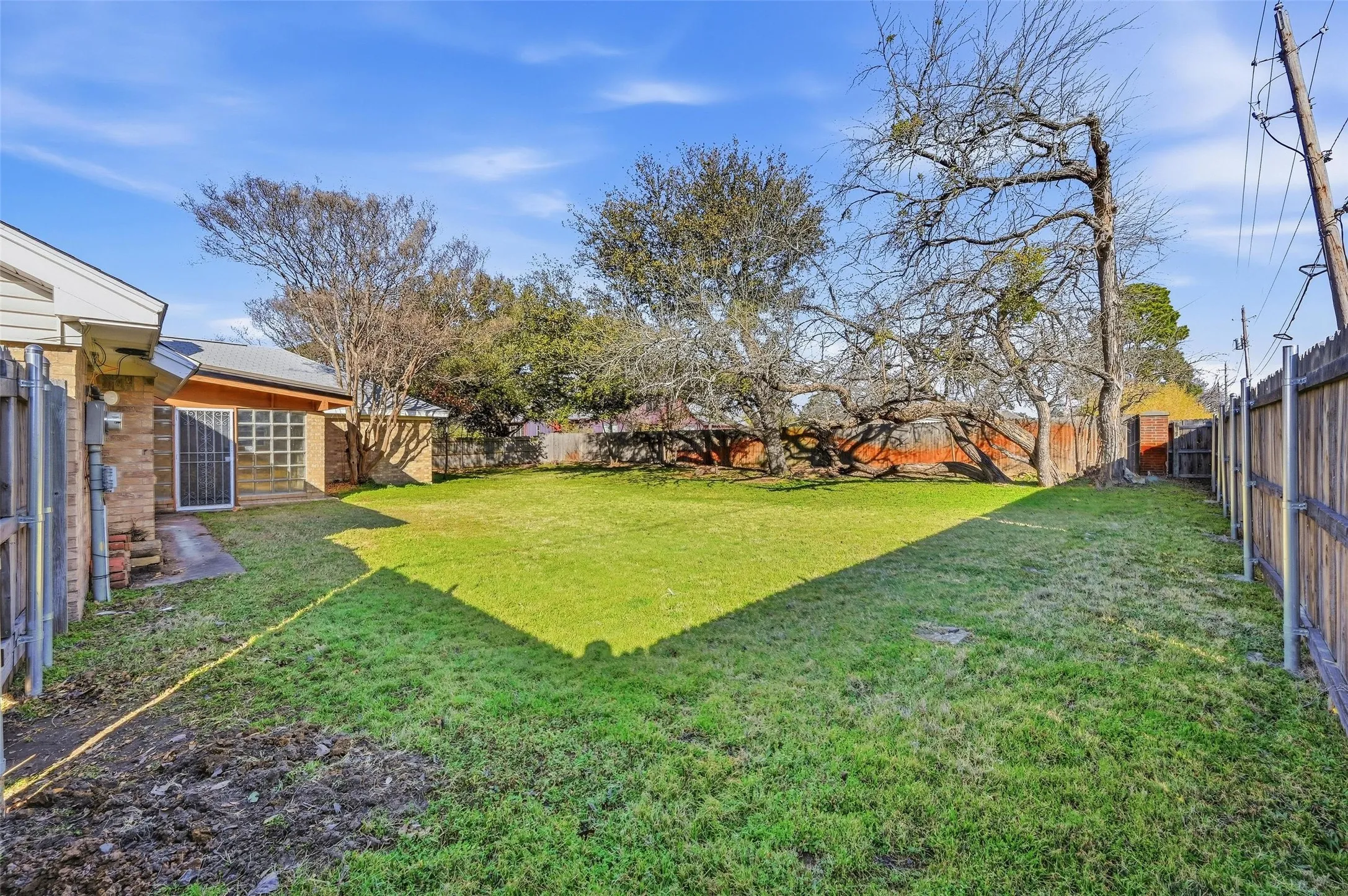 Expansive green lawn provides ample outdoor space
