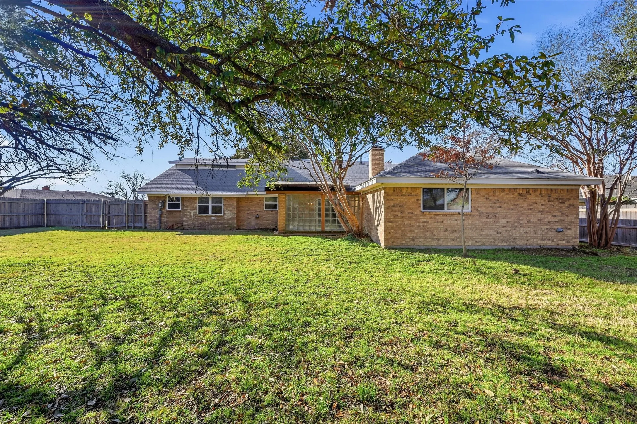 Expansive green lawn providing ample outdoor space