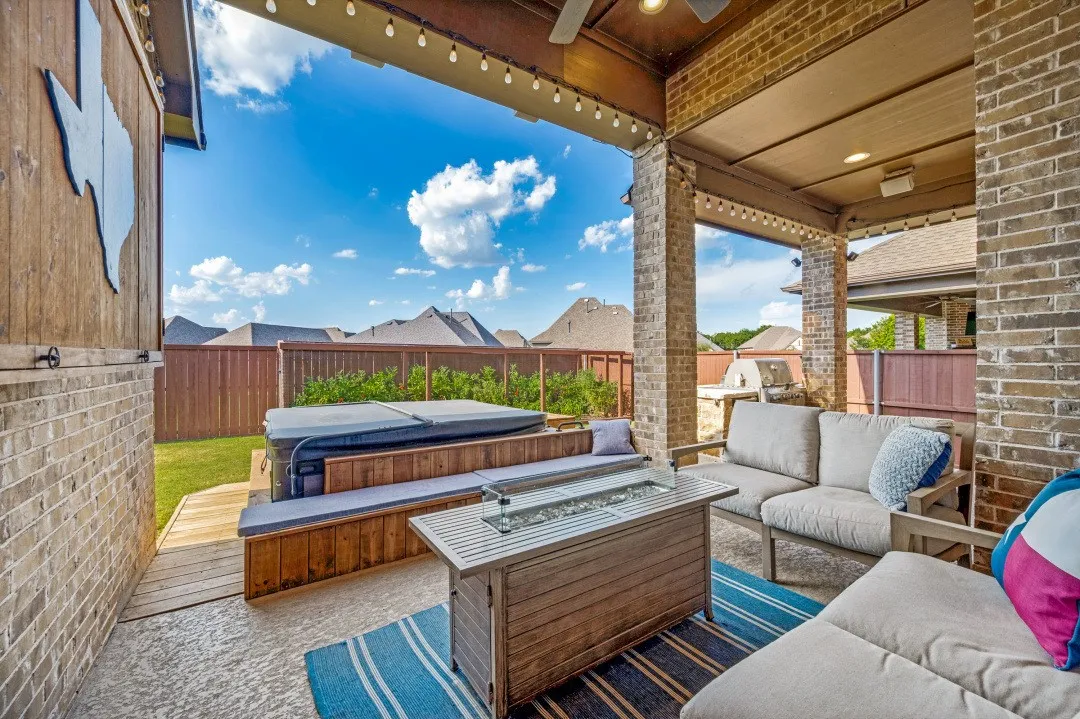 Covered patio featuring recessed lighting, string lights, and a ceiling fan