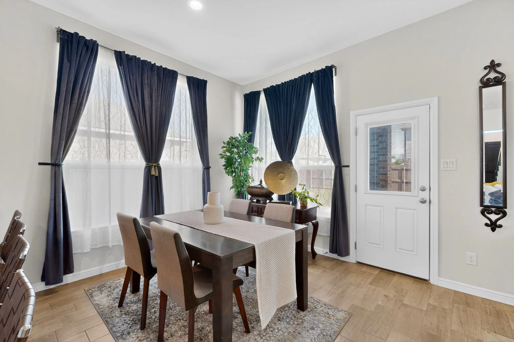Dining area featuring wood-finish flooring and light-toned wall paint
