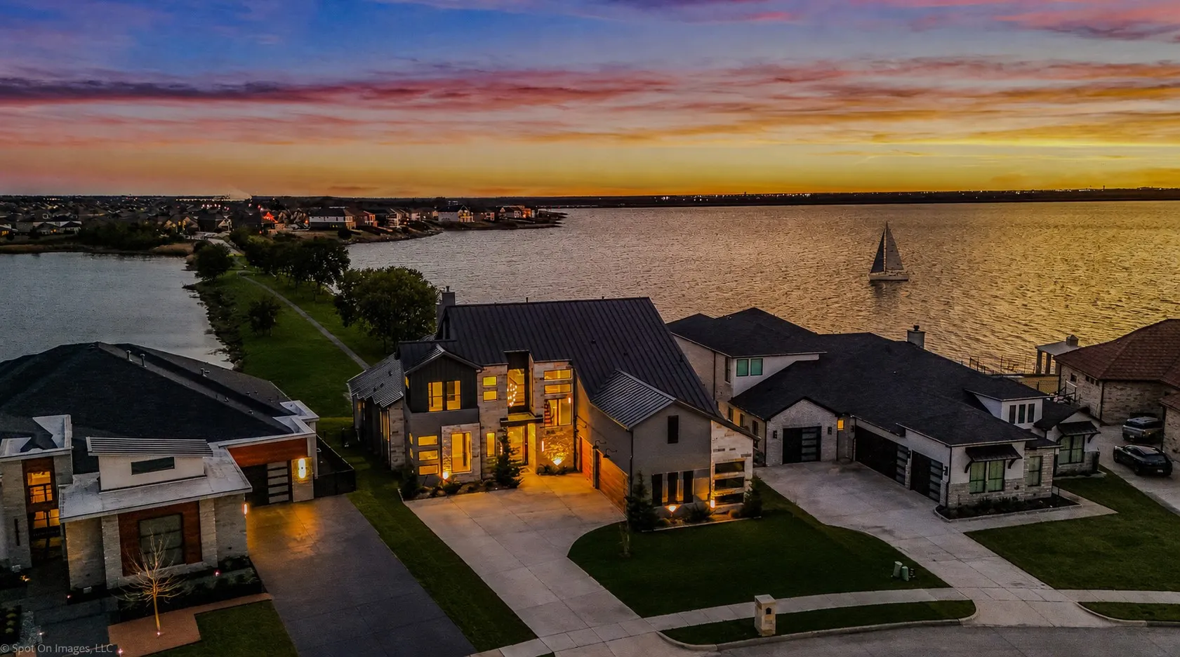 Modern architectural residence featuring a prominent waterfront setting