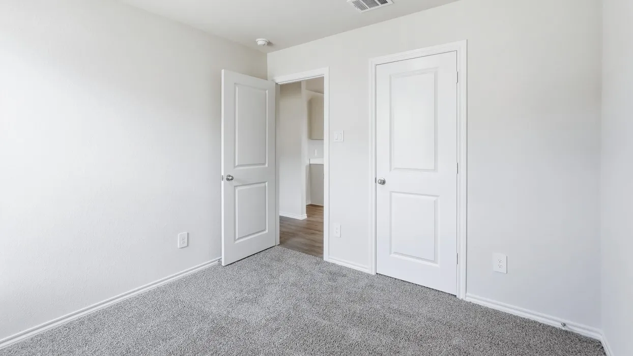 Room featuring neutral gray carpeting and white walls