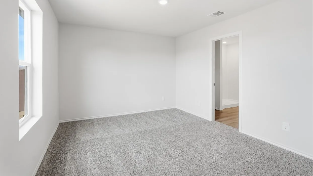 Interior room featuring light gray carpeting, white walls, and a single window with white trim