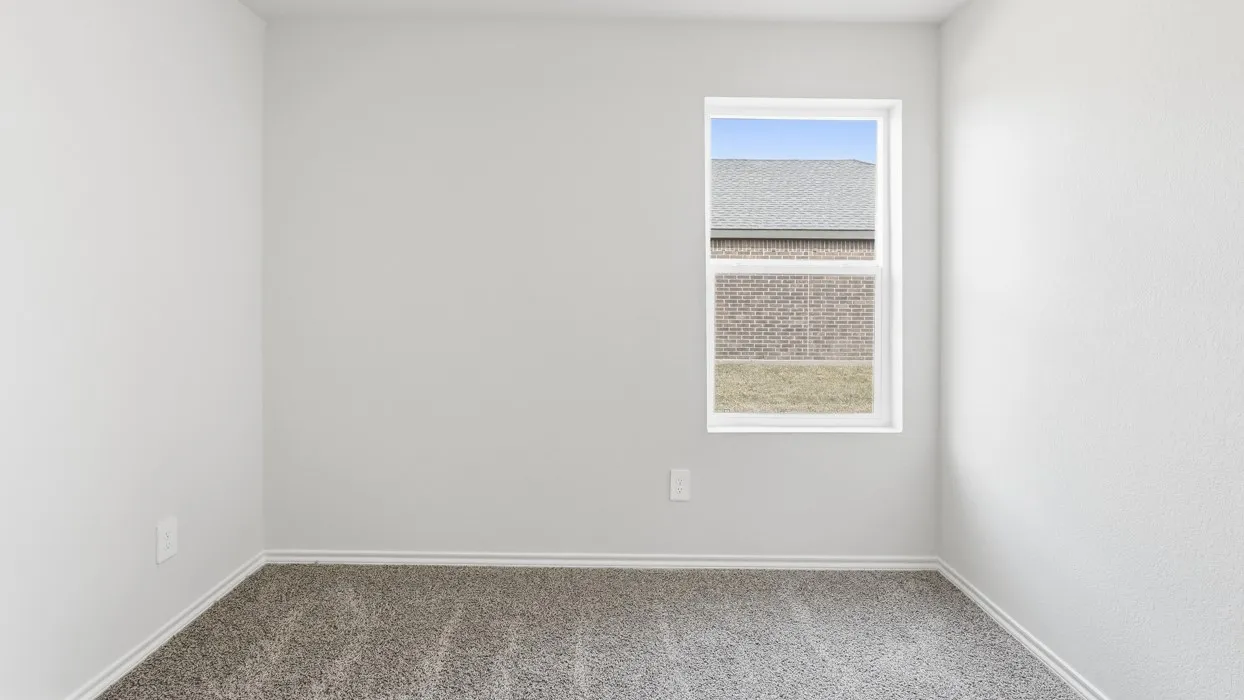 Neutral-toned walls complement plush carpet flooring