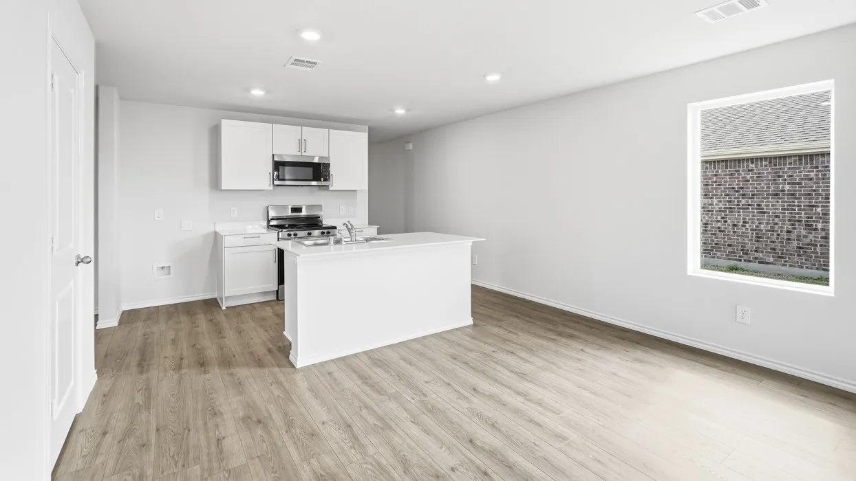 Kitchen featuring white cabinetry, white countertop, stainless steel appliances, and wood-finish flooring