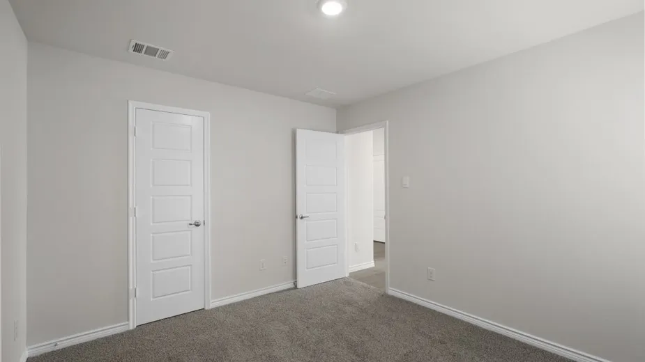 Neutral gray wall paint and gray carpeting create a versatile interior