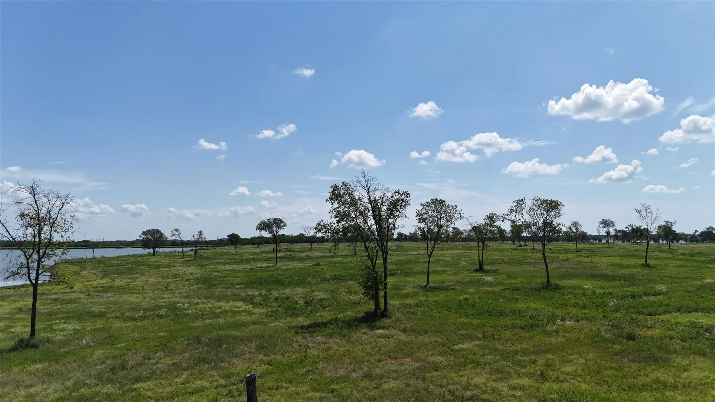 Scattered mature trees offer privacy while preserving plenty of room for your custom lake house in Navarro County.