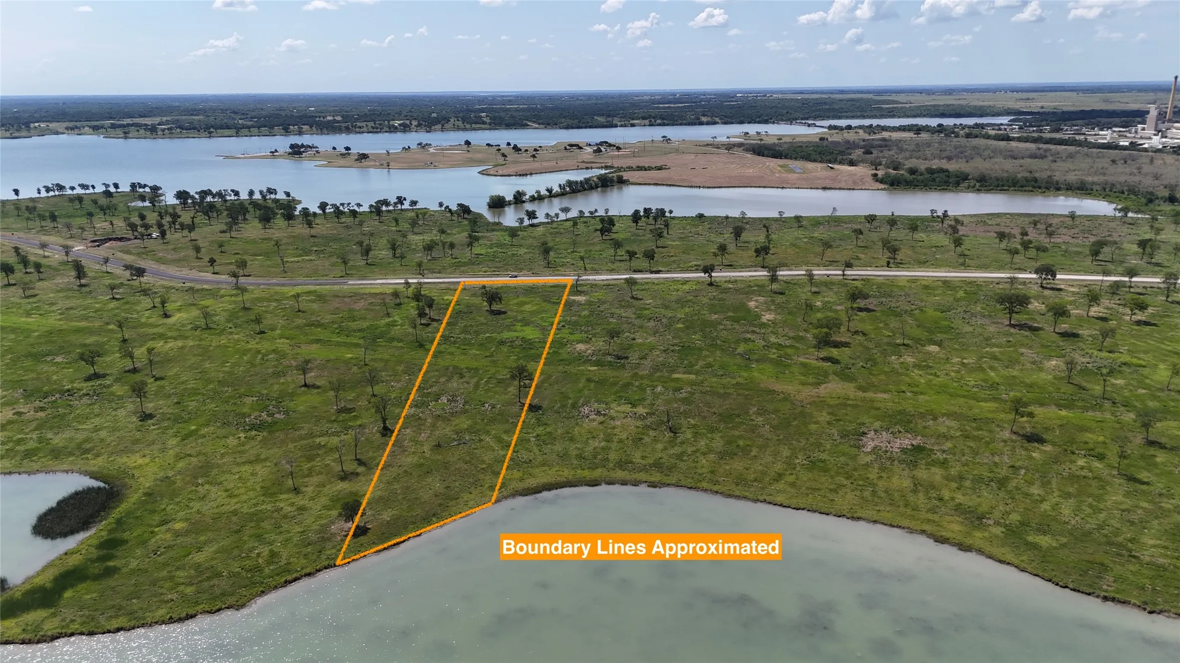 Mature trees add natural beauty while preserving the open feel of this spacious homesite.