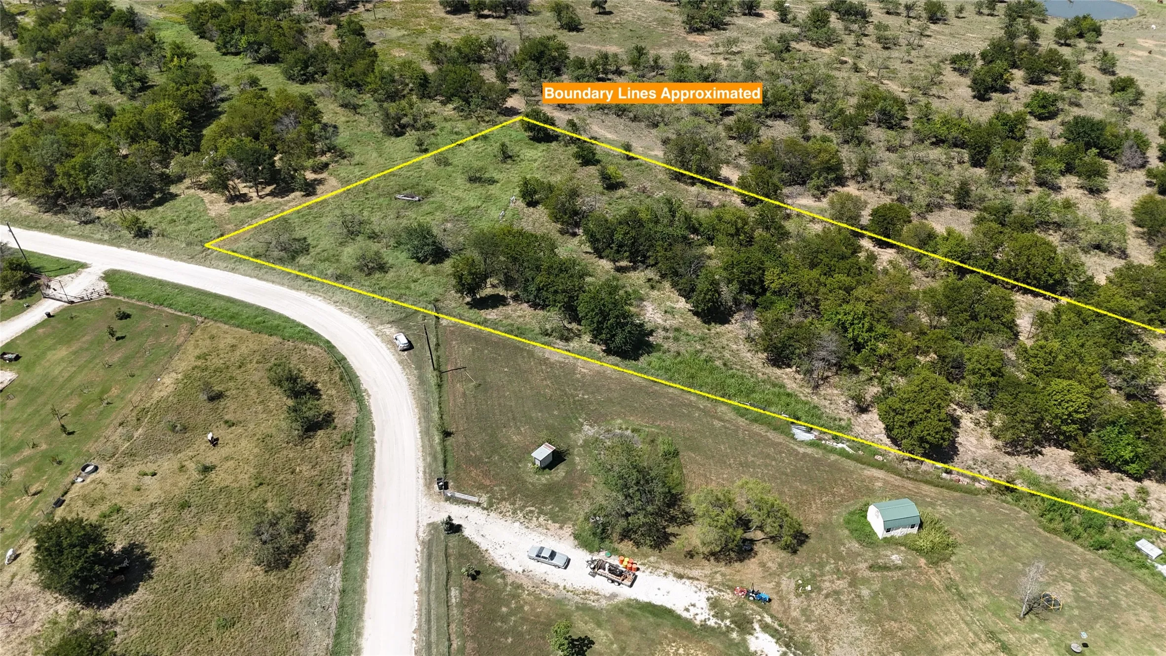 Open pasture and natural grasses provide plenty of usable space for gardens, workshops, animals, or recreation.