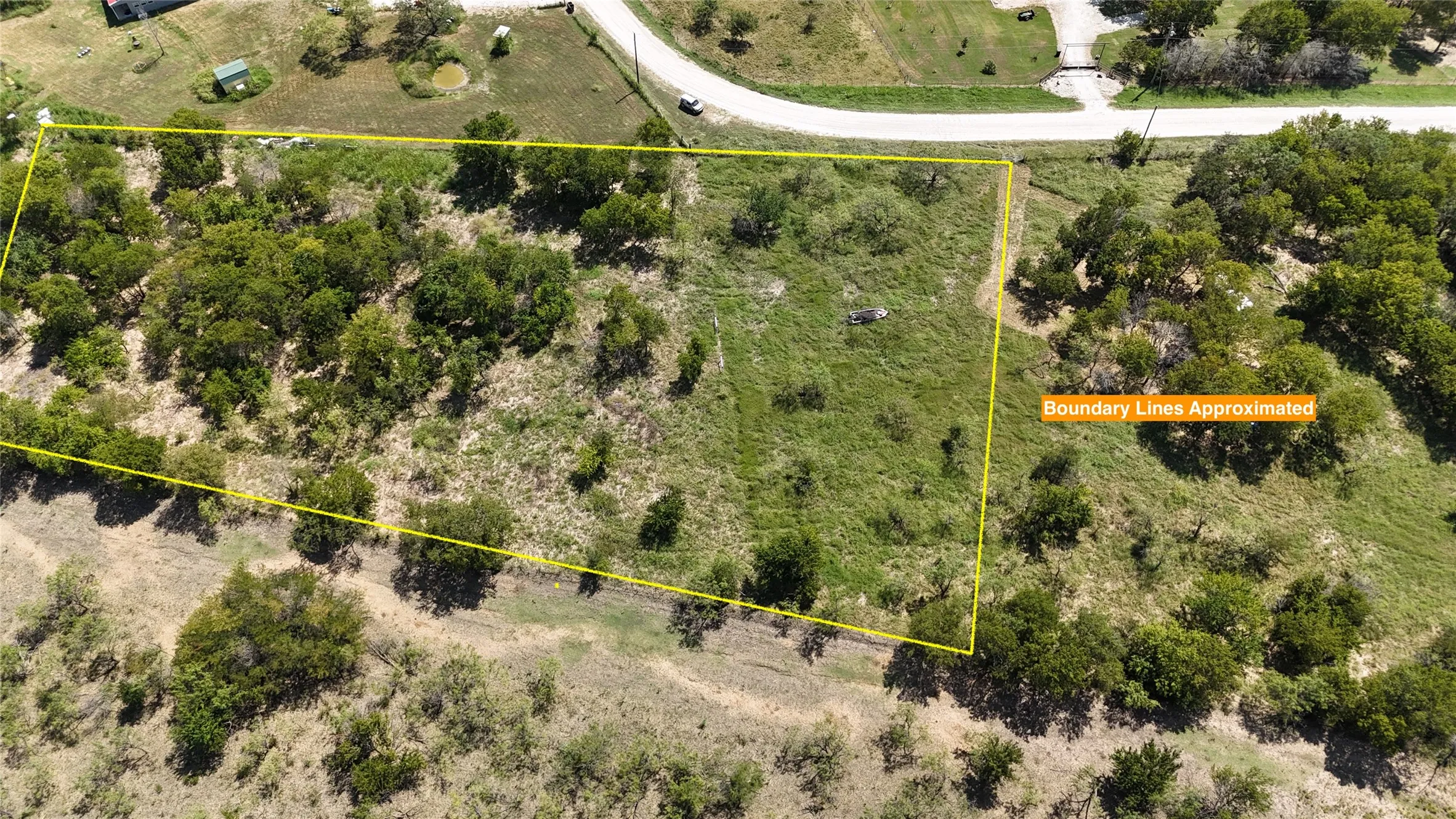 A beautiful blend of native grasses and scattered trees creates a peaceful backdrop for your future country lifestyle.