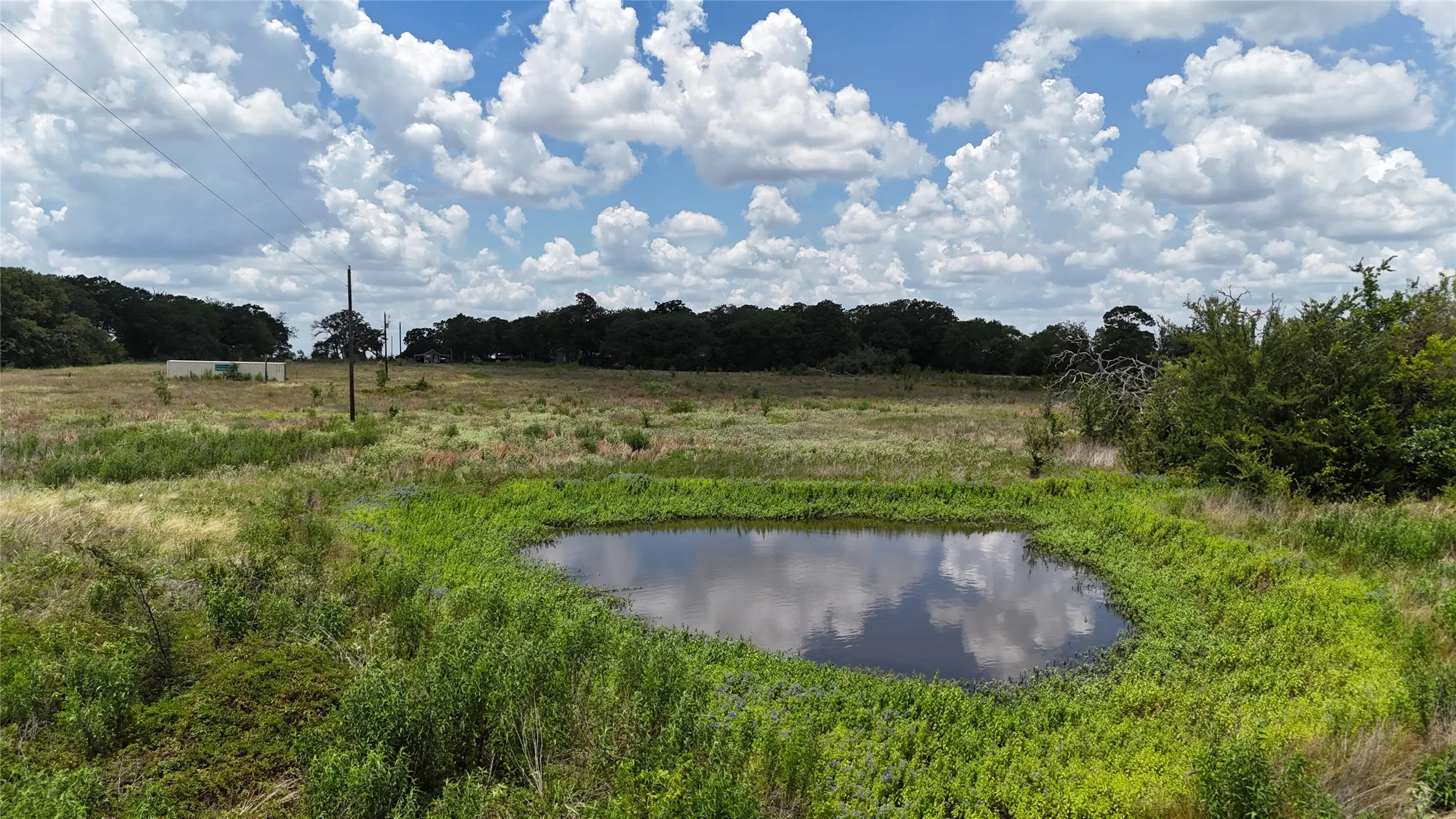 A pond adds character and function to this inviting 6.75-acre tract.
