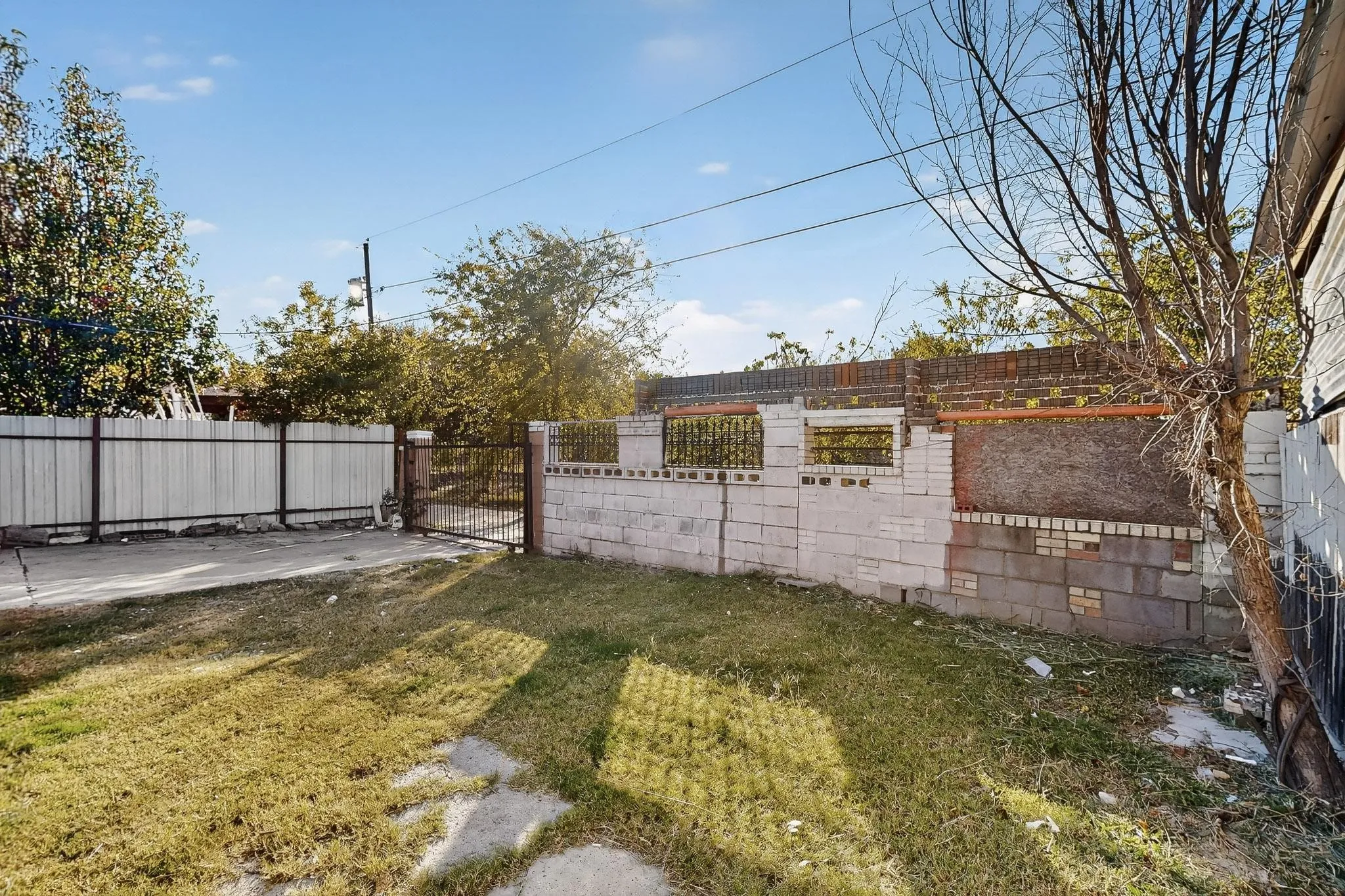 Fenced yard featuring a gate