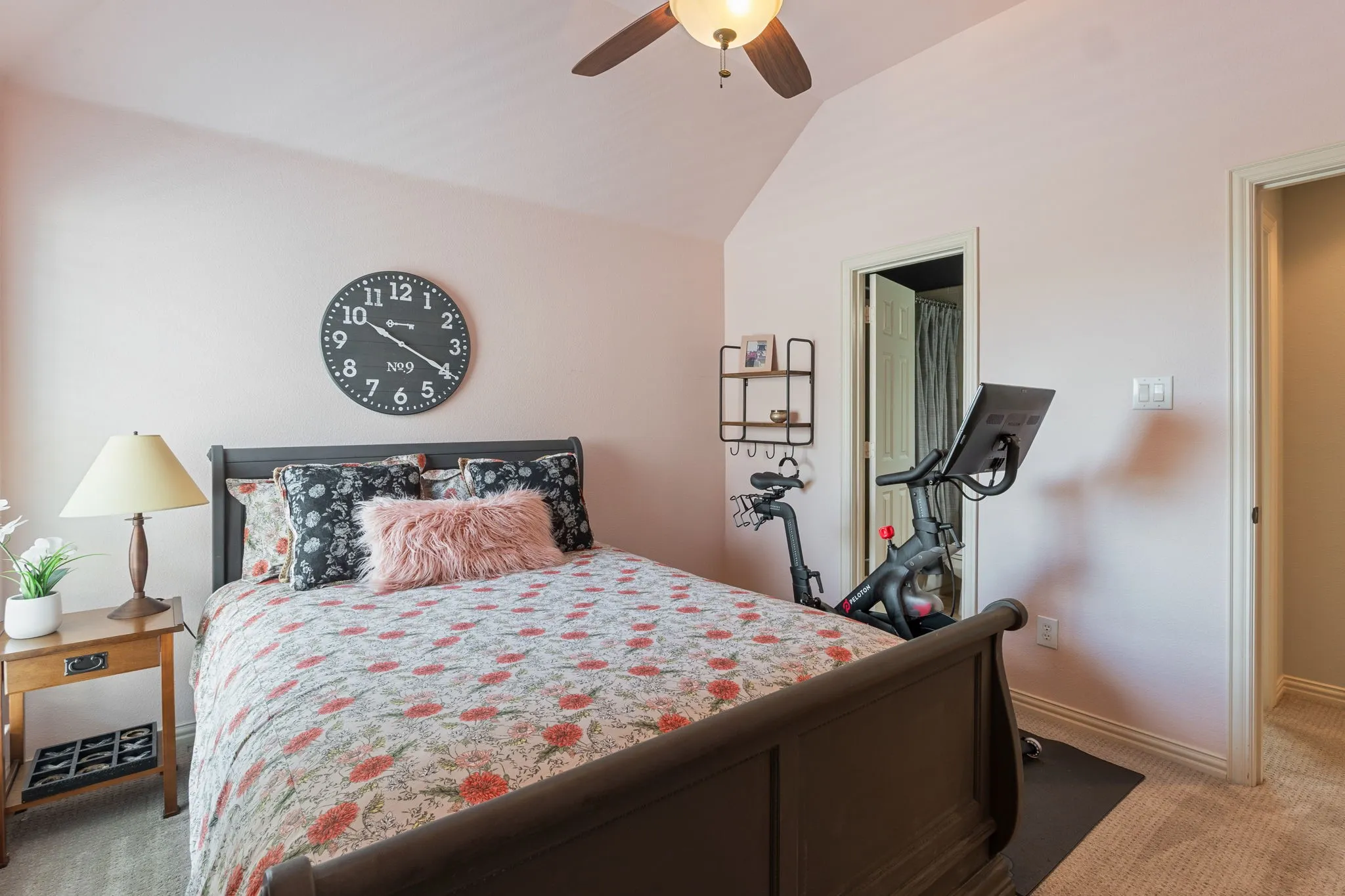 Room featuring vaulted ceilings and a ceiling fan