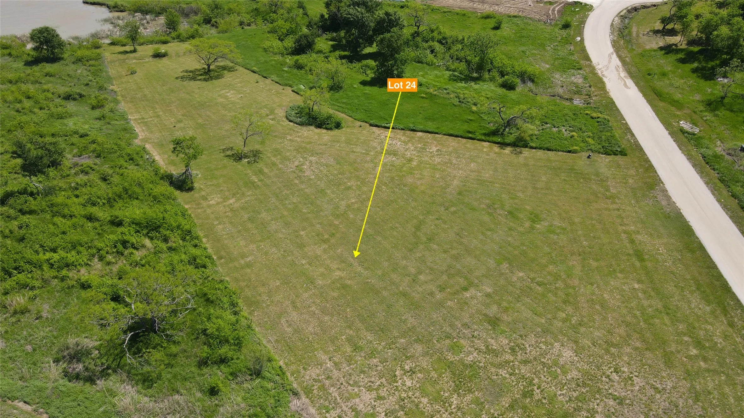 A wide, level building site offers flexibility for designing your custom home while enjoying the privacy of this spacious Richland Park property.