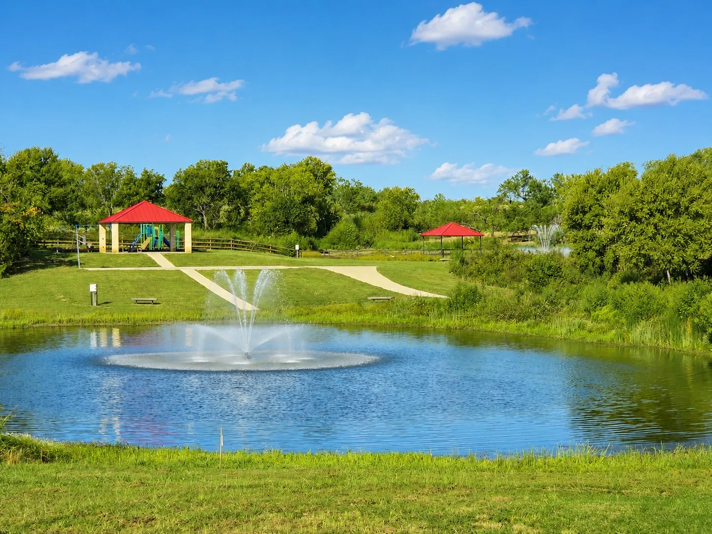 Community park, walking paths, playground, and pond provide additional outdoor recreation for residents of all ages.