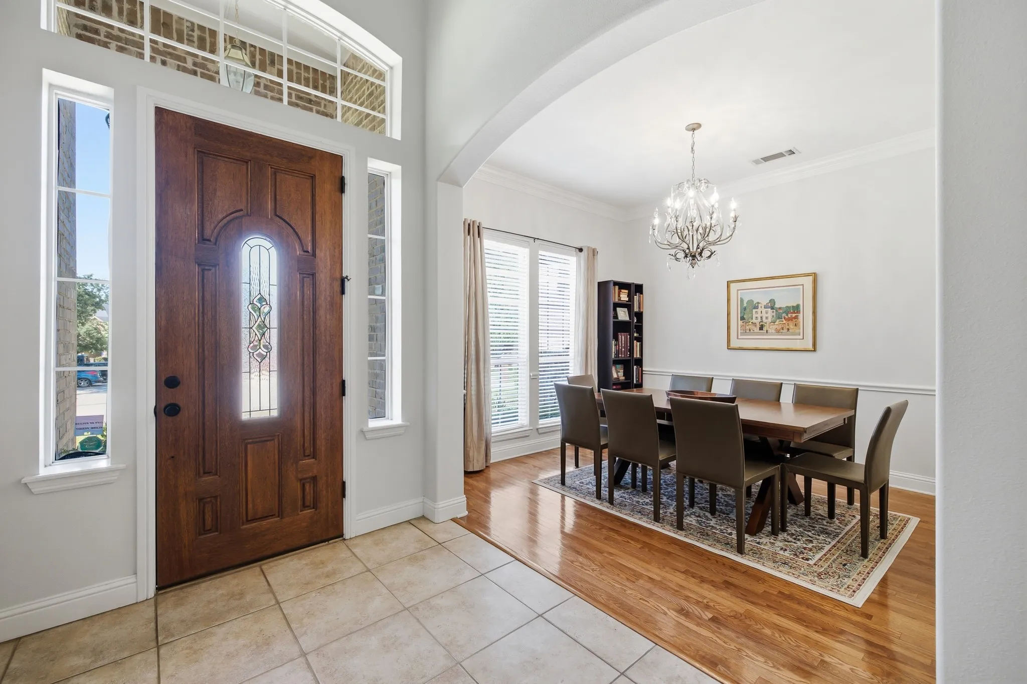 Inviting entryway featuring a rich wood-finish door