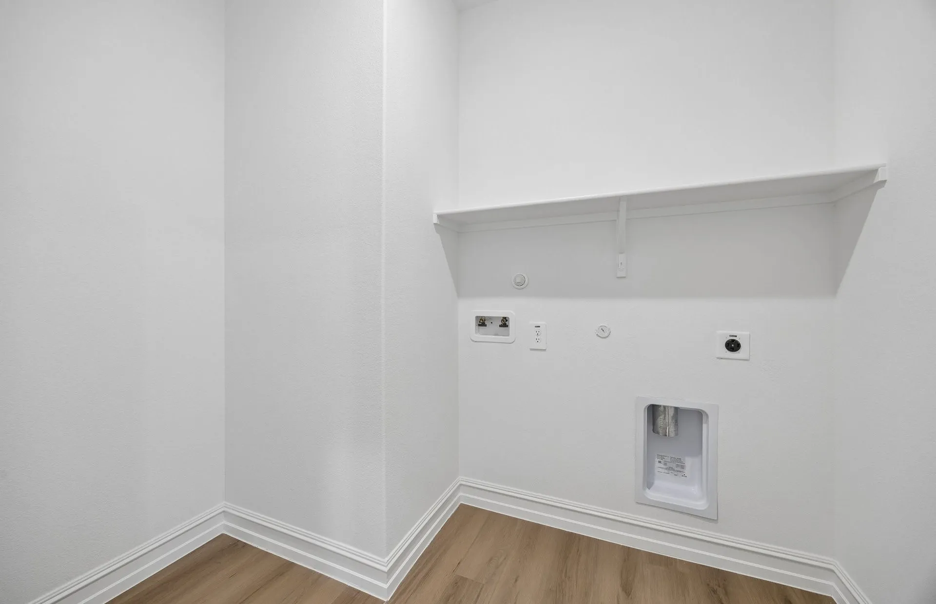 Laundry room with built-in shelving