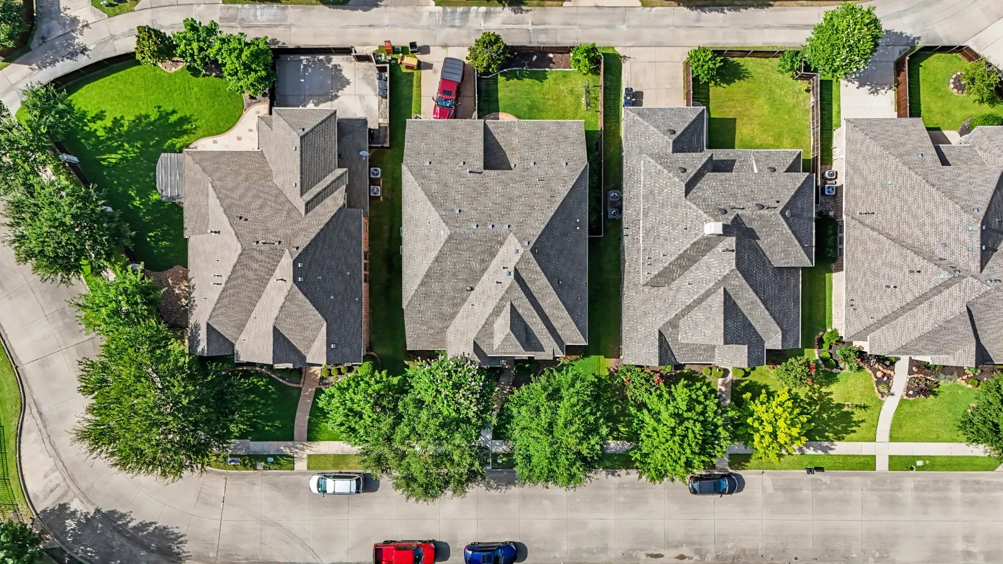 Aerial perspective showcasing a residential property with a multi-gabled roofline