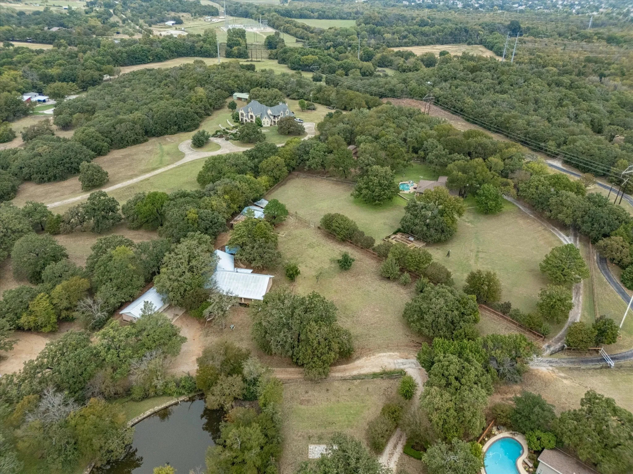 Aerial view was taken before recent roof replacement to asphalt shingles.