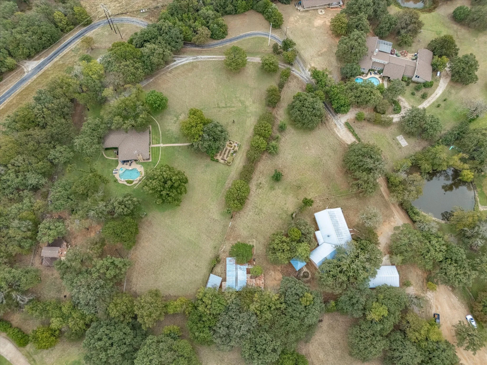 Aerial view was taken before recent roof replacement to asphalt shingles.