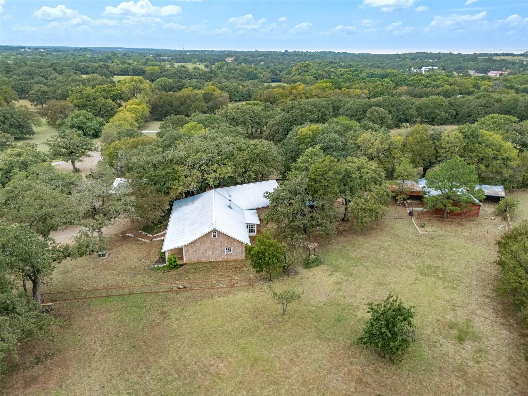 Aerial view was taken before recent roof replacement to asphalt shingles.