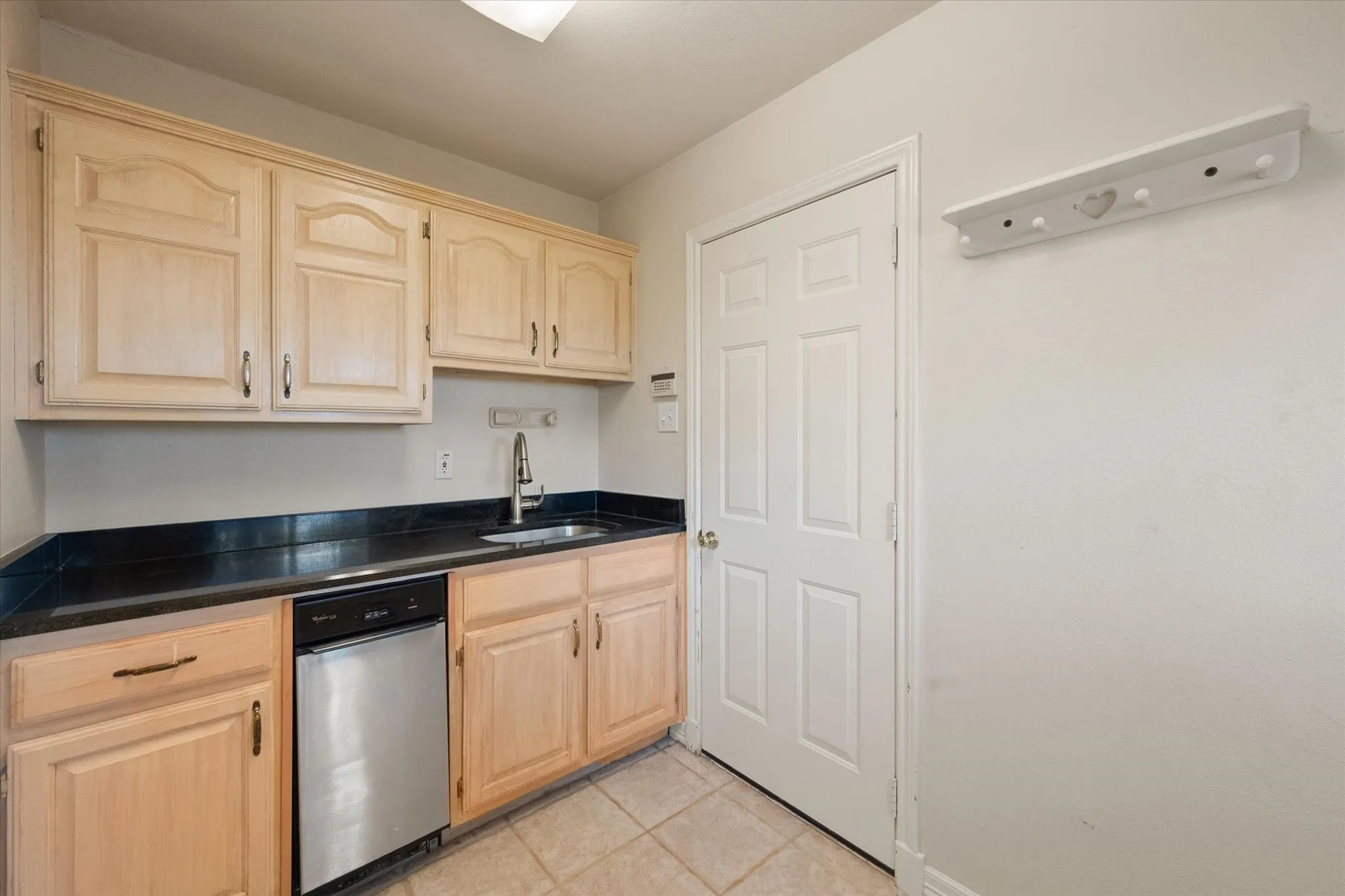 Laundry room with sink, cabinets and counter for folding