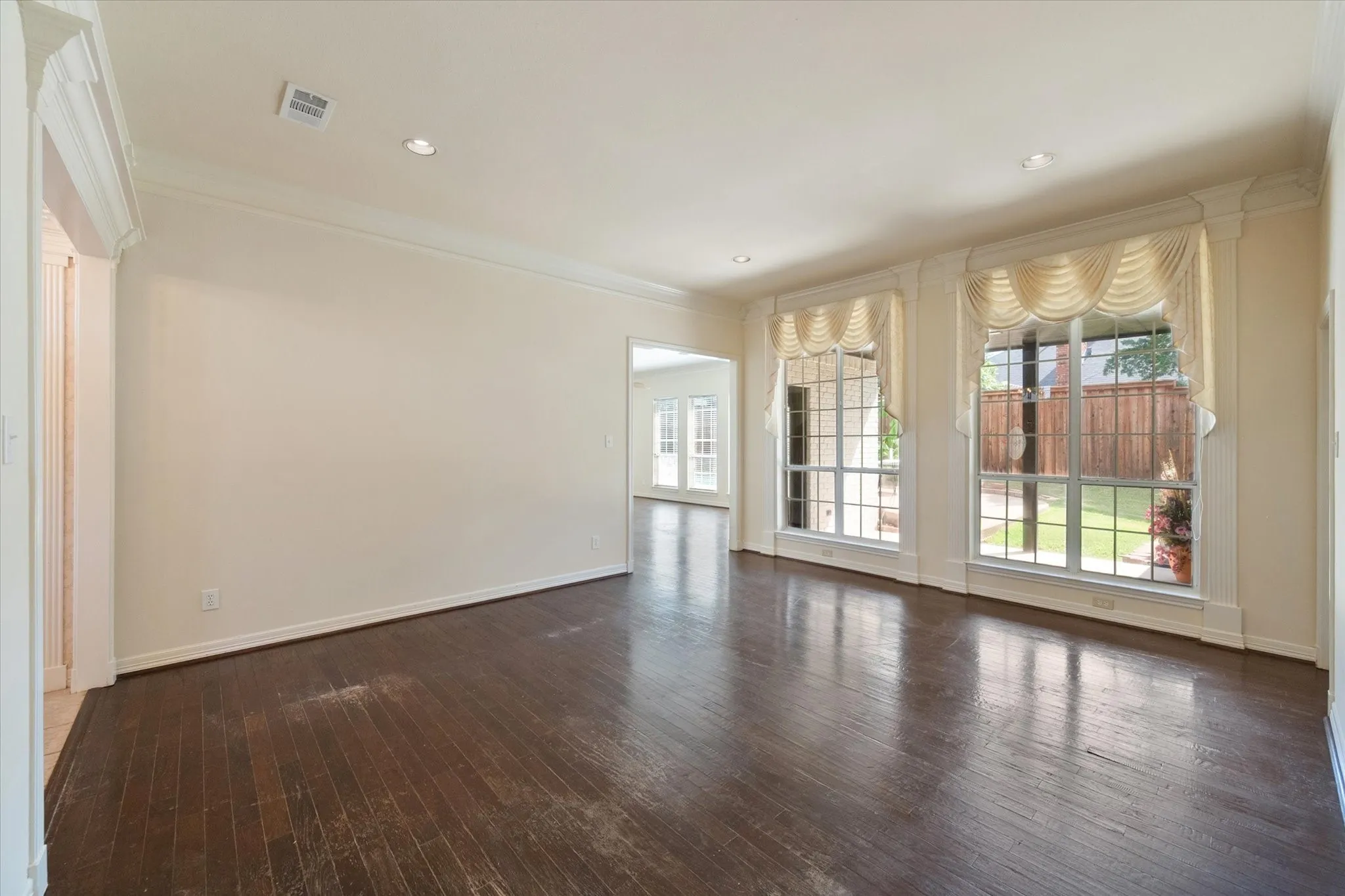 Living room with a view of patio and backyard