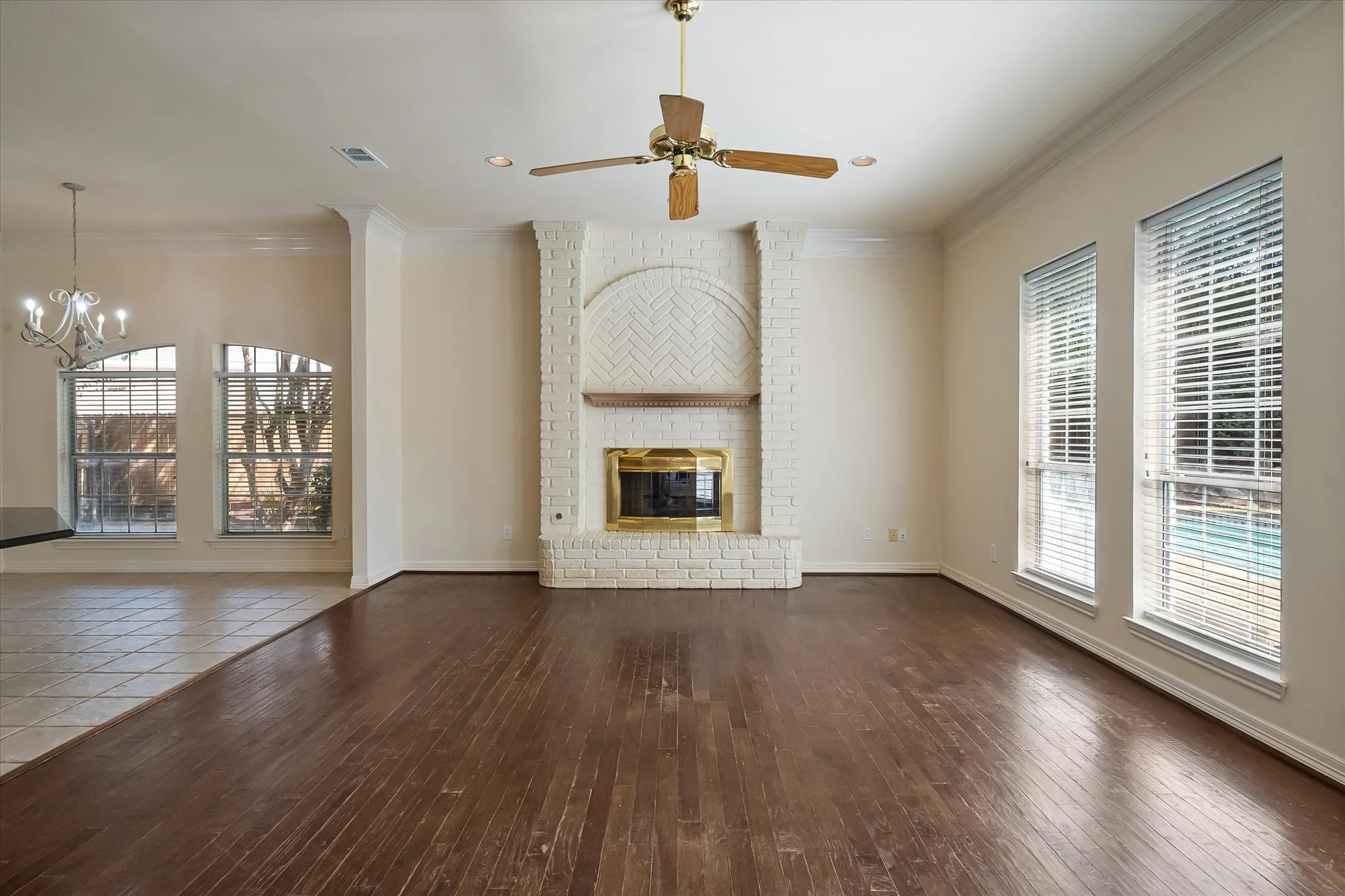 Family room features floor to ceiling brick fireplace with gas logs
