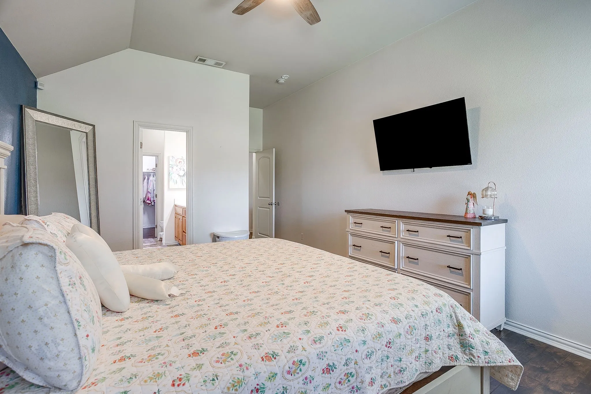 Bedroom featuring vaulted ceilings and a ceiling fan