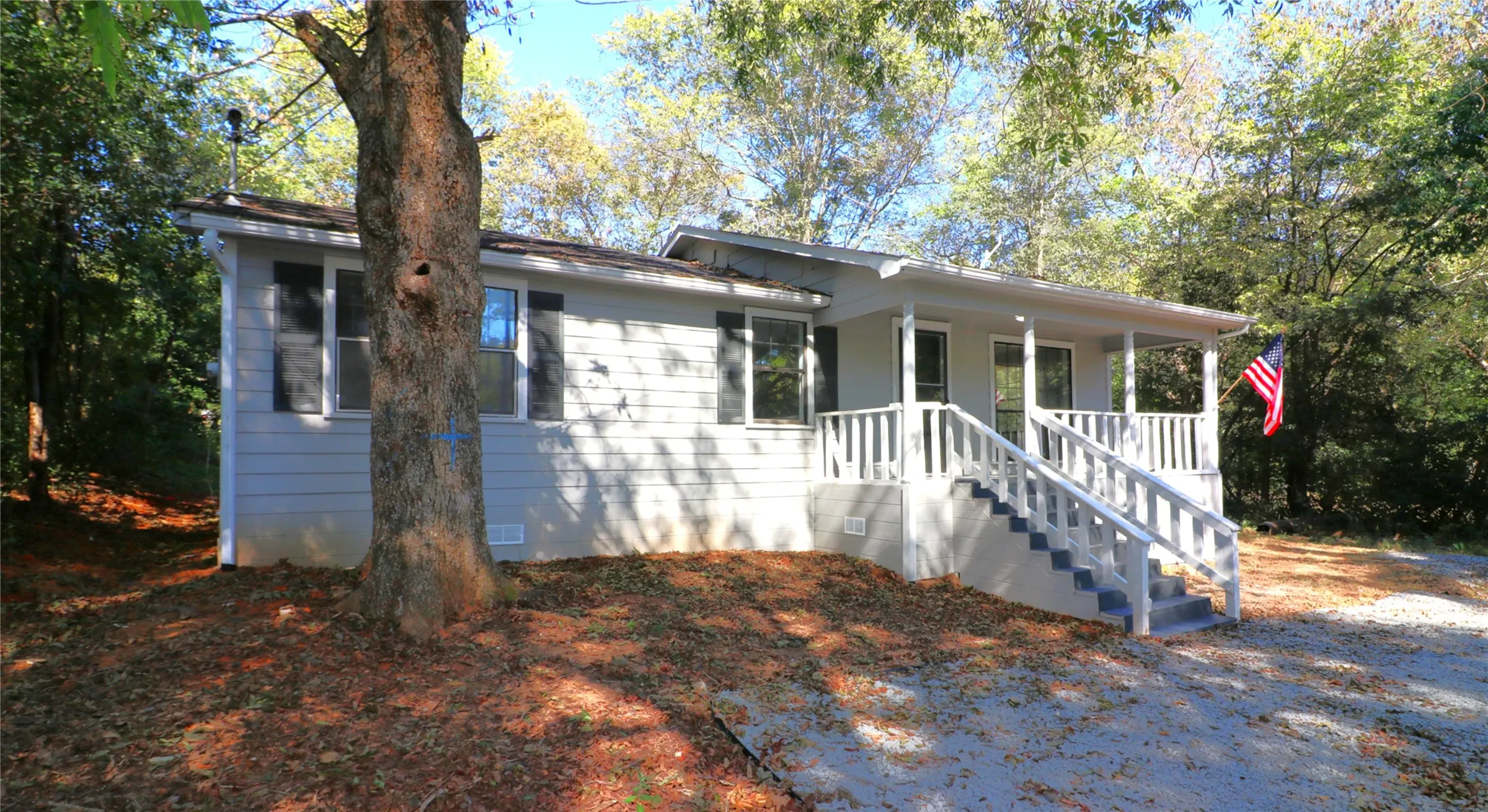 View of front of home with covered porch and crawl space