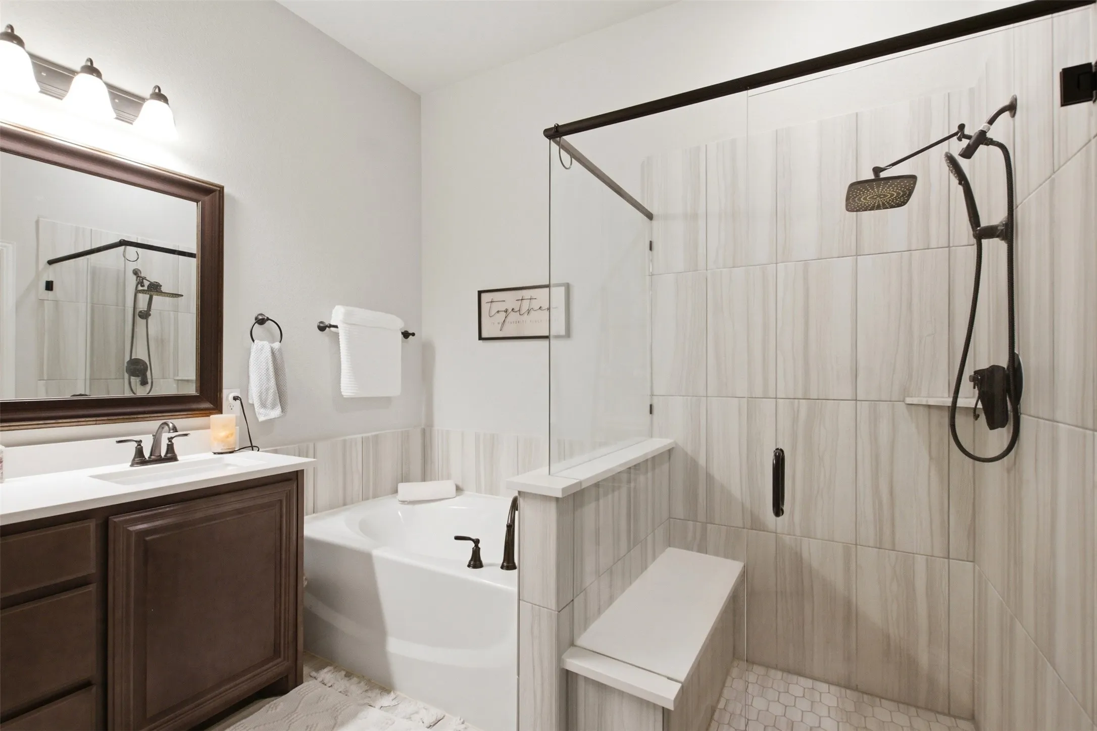 Primary ensuite offers a separate walk-in shower, garden tub, dual functionality, and a private toilet room.