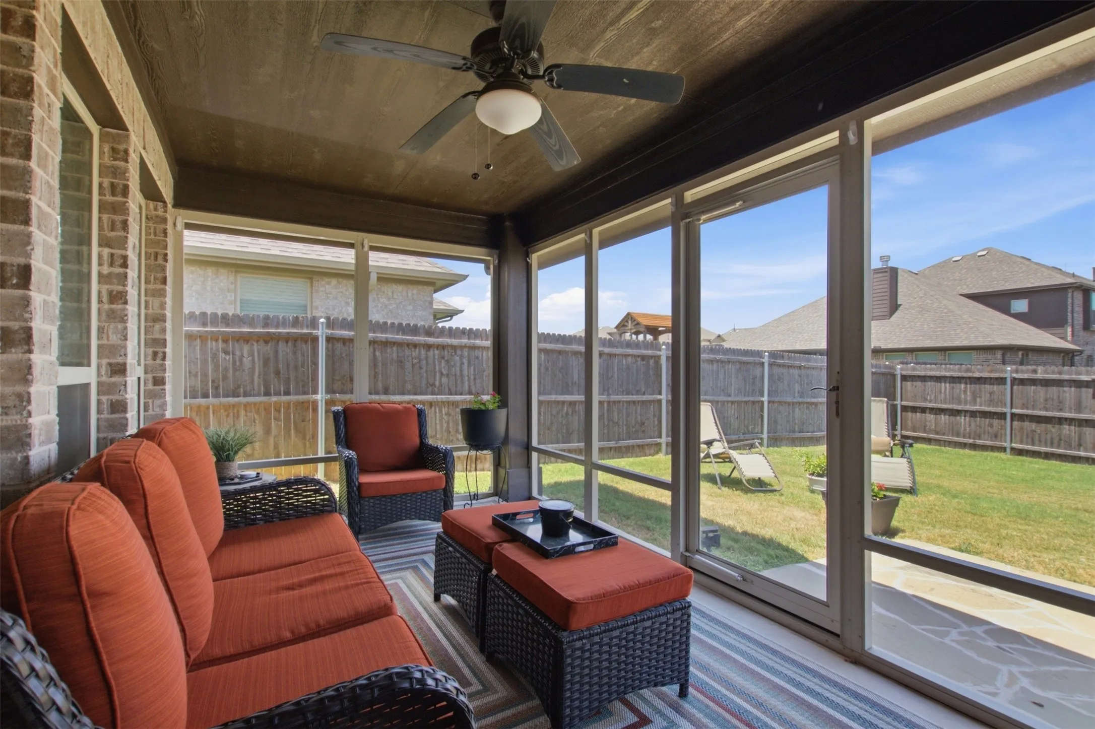 Screened-in patio built for comfortable outdoor living and entertaining