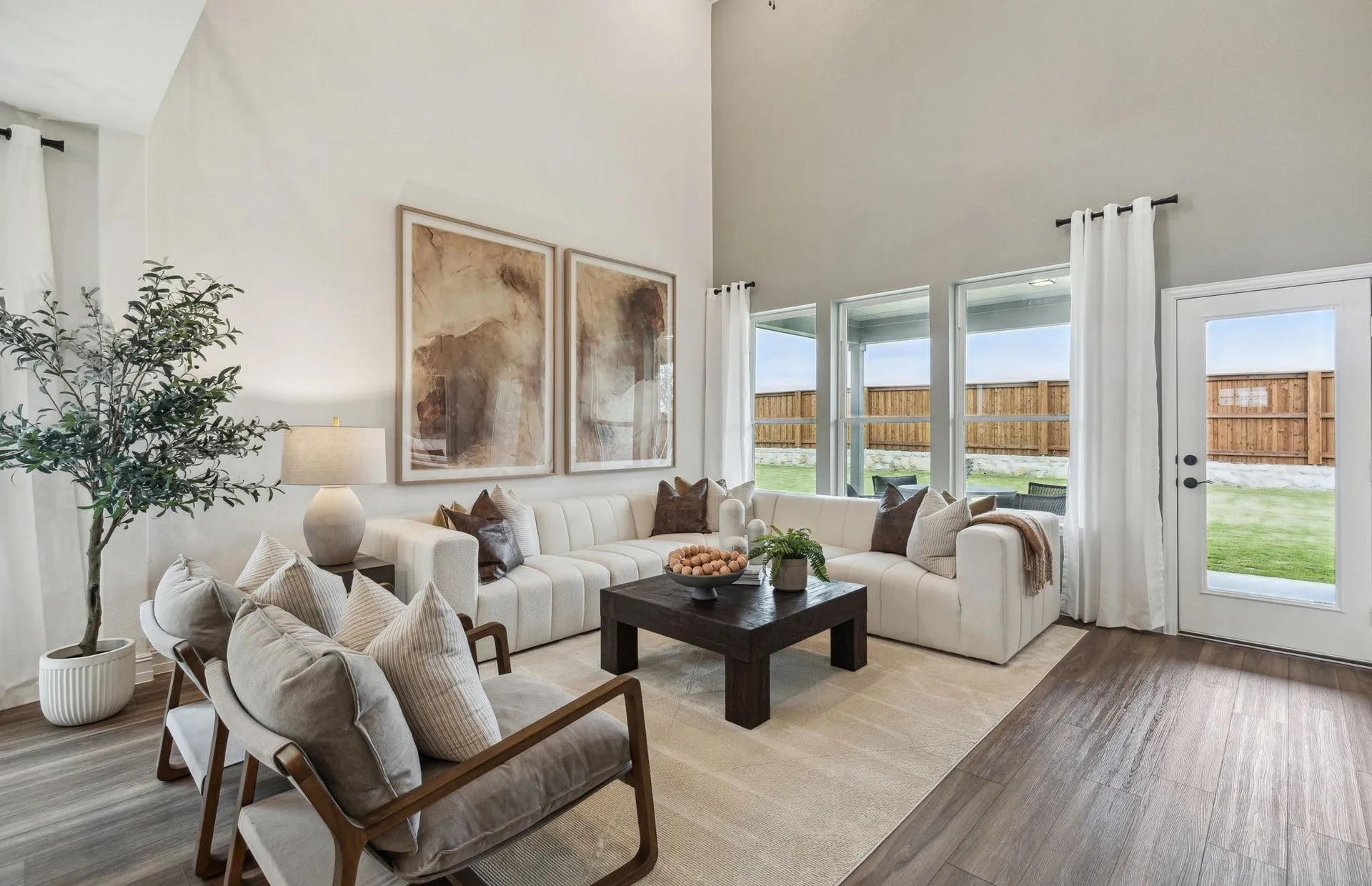 *Model Representation - Spacious gathering room with large windows