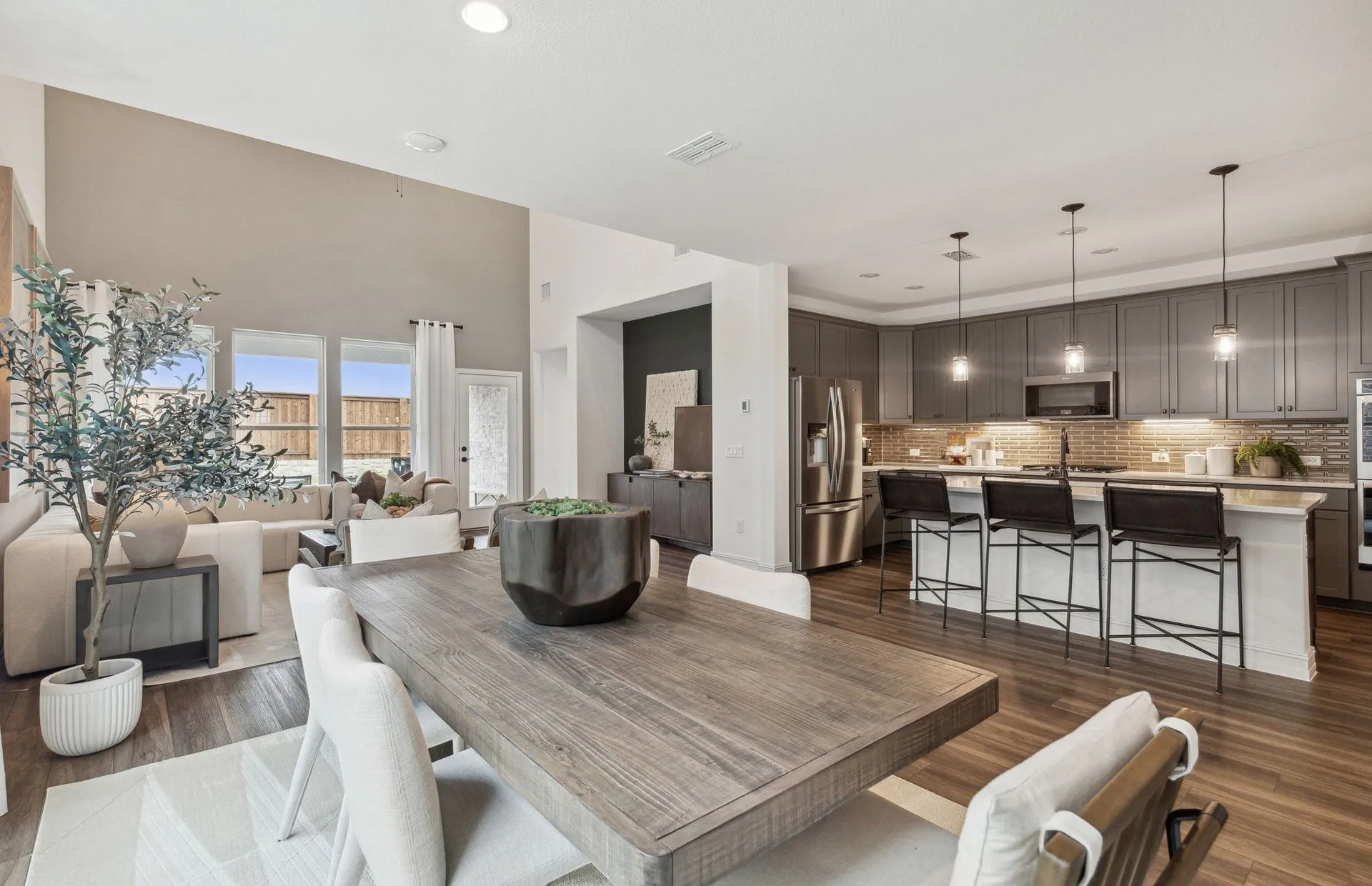 *Model Representation - Large island overlooking gathering room and dining areas