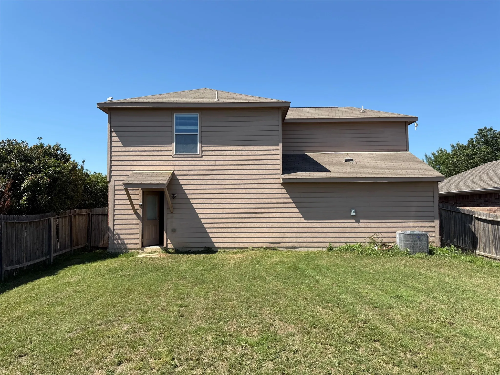 Two-story exterior with horizontal siding and a gabled roof