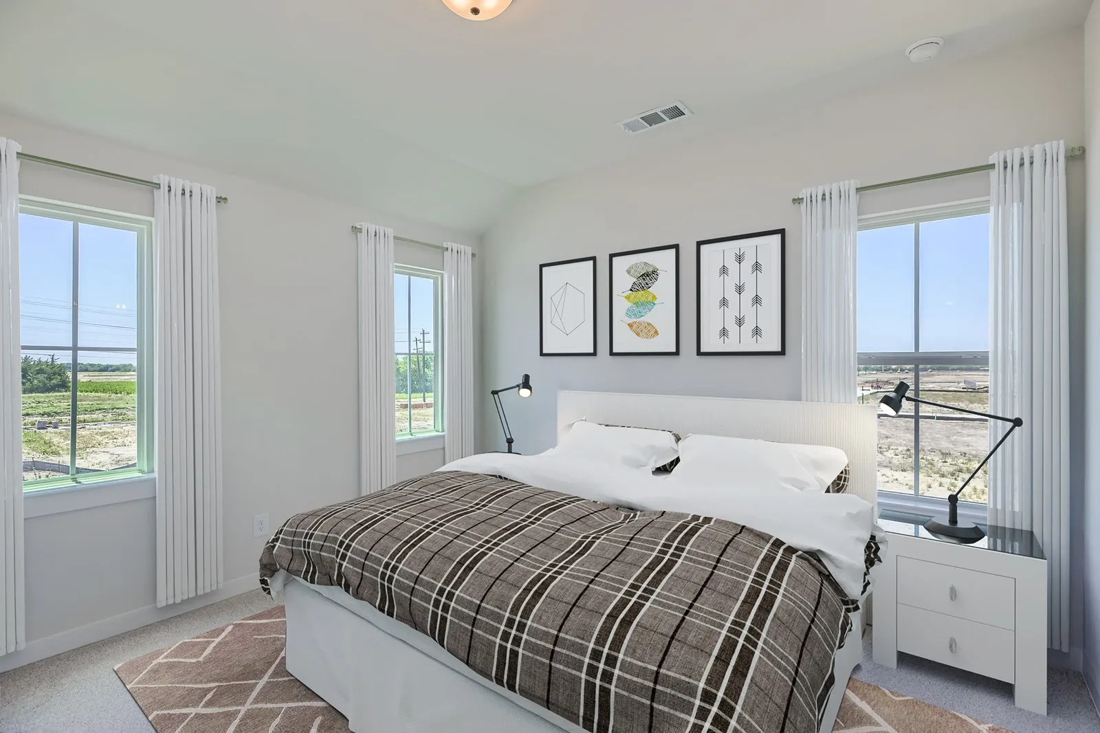 Bright room featuring multiple windows with expansive outdoor scenery