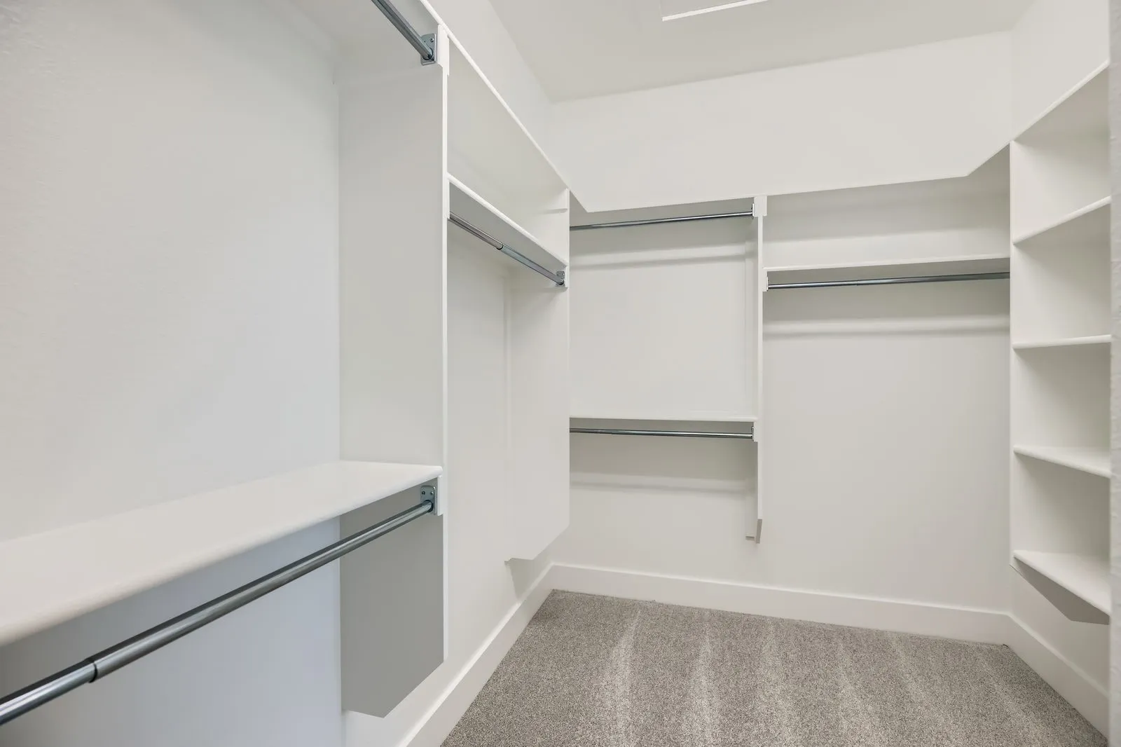 Built-in shelving and hanging rods offer ample storage
