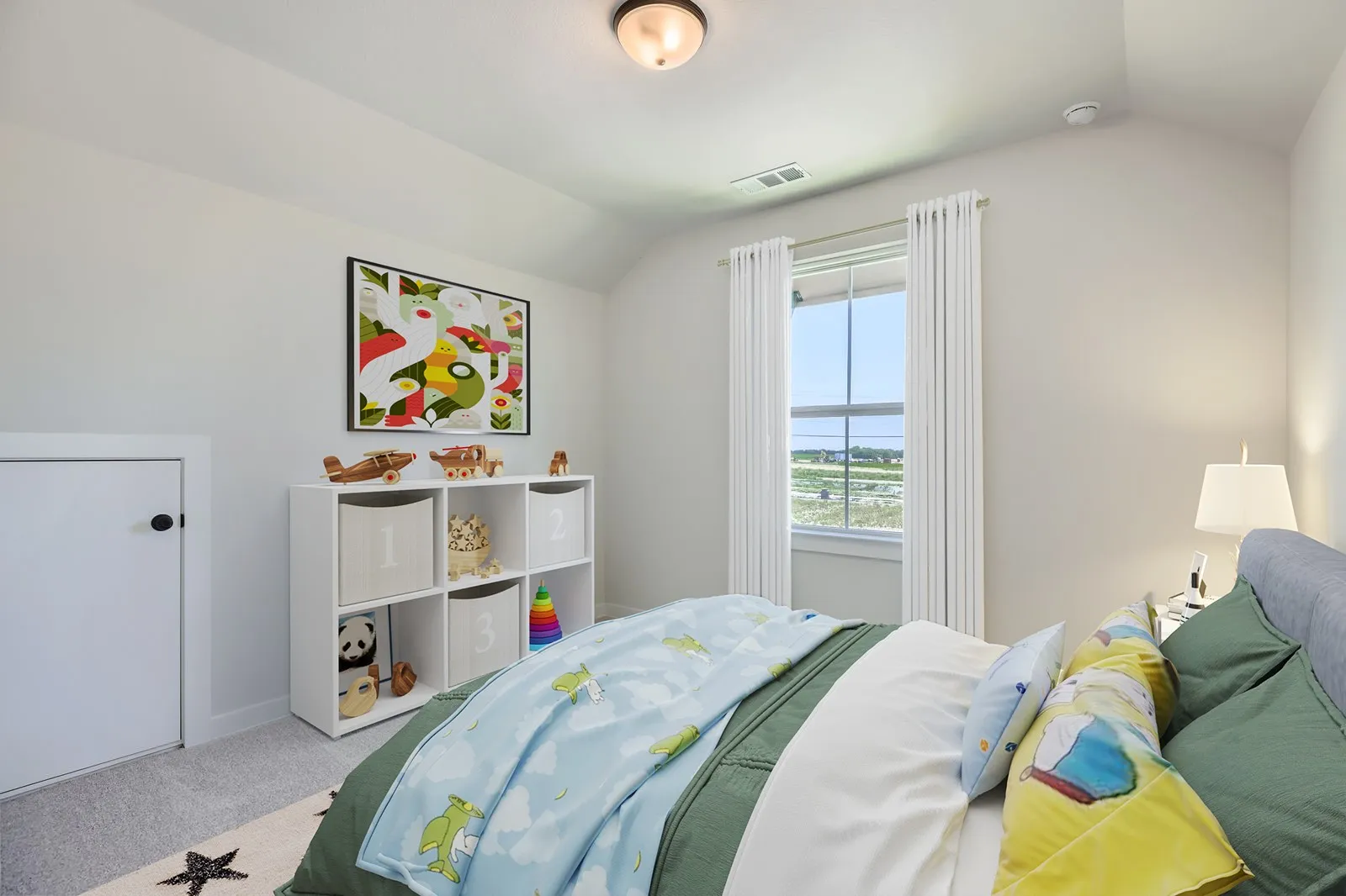 Bright room featuring a single window with white curtains, light gray carpeting, and a sloped ceiling